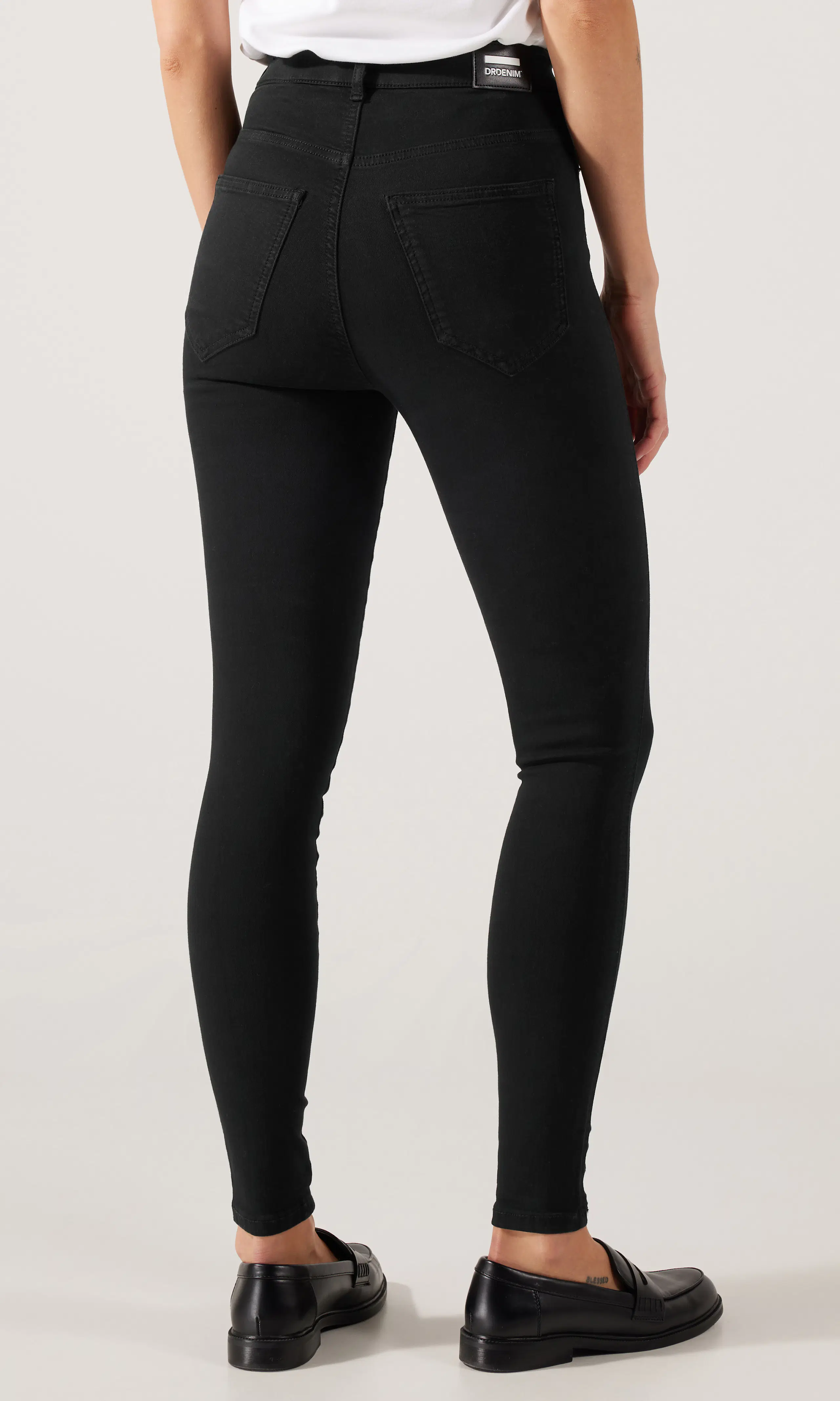 Moxy High Skinny Jeans. Back. Model.