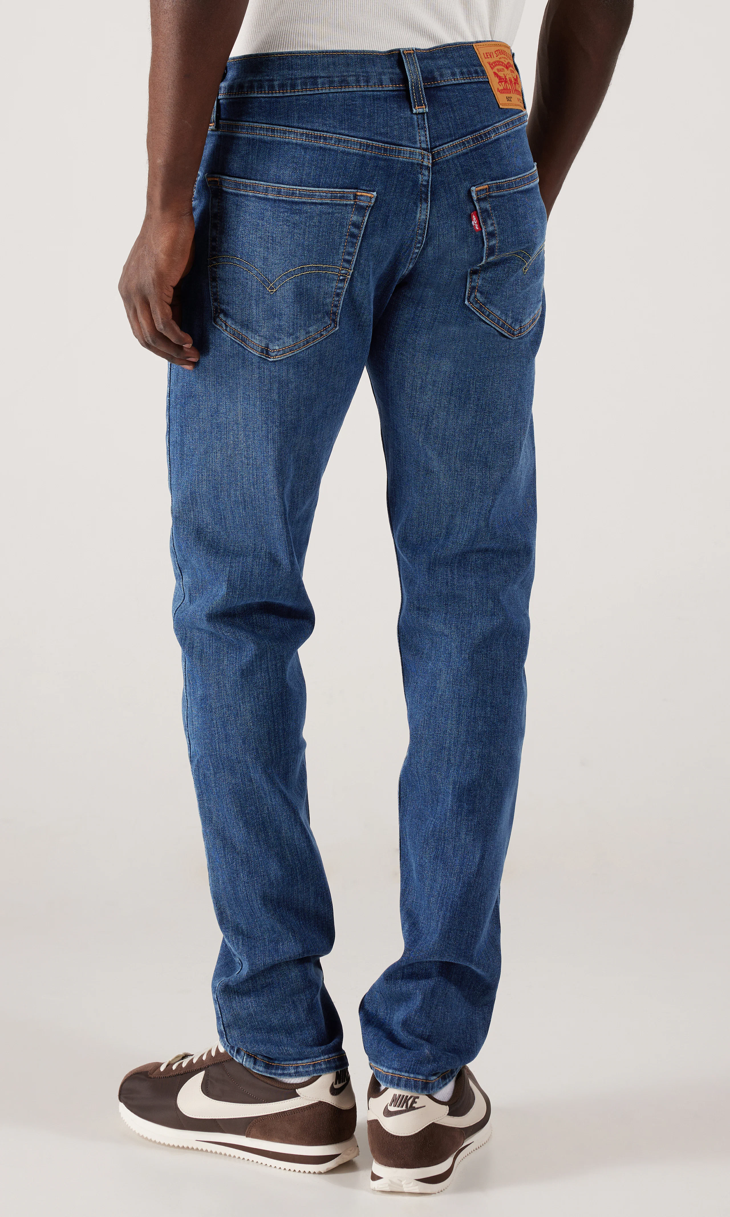 502™ Taper Jeans. Back. Model.