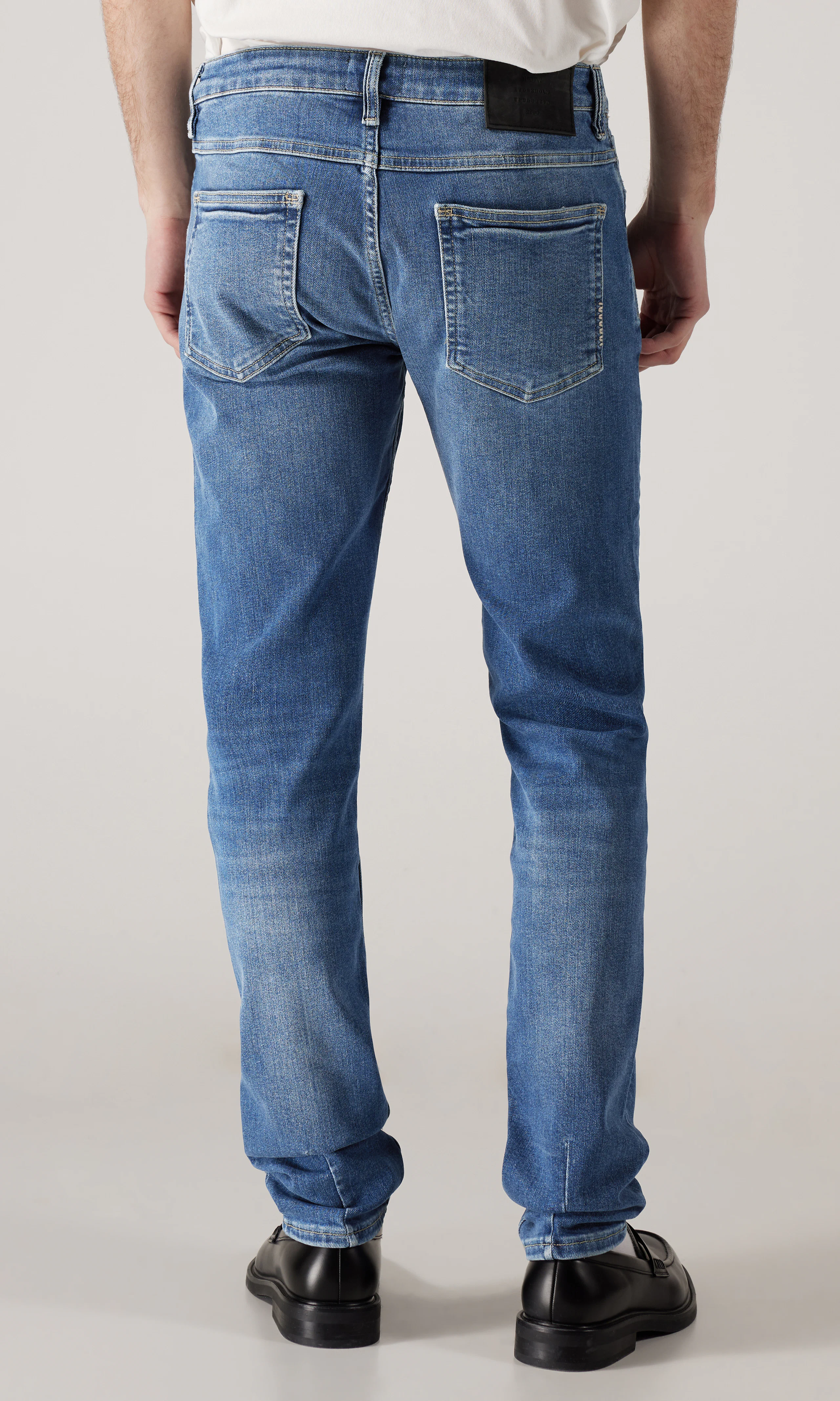 Lou Slim Jeans. Back. Model.
