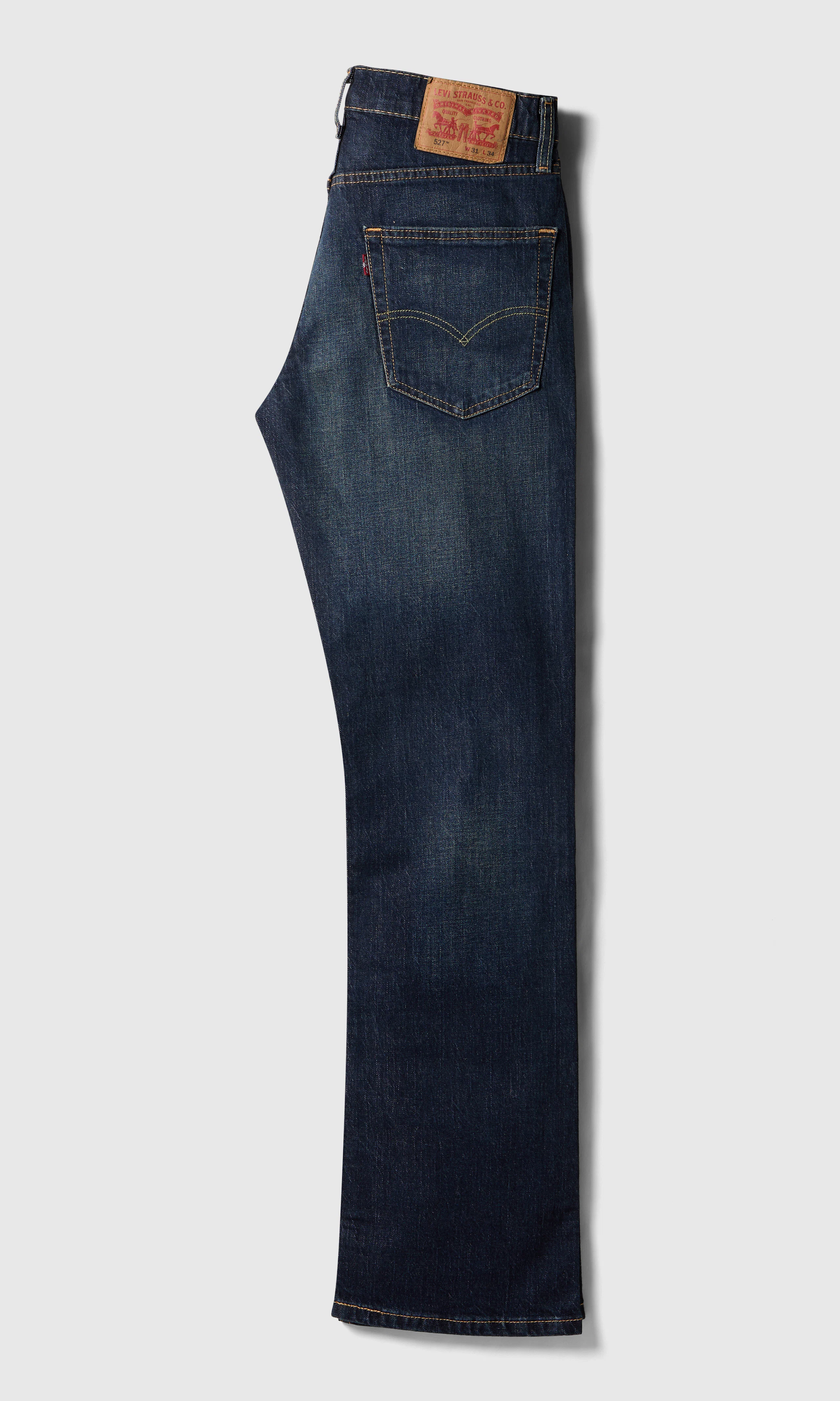 527™ Slim Bootcut Tummansiniset Farkut. Back. Flat.