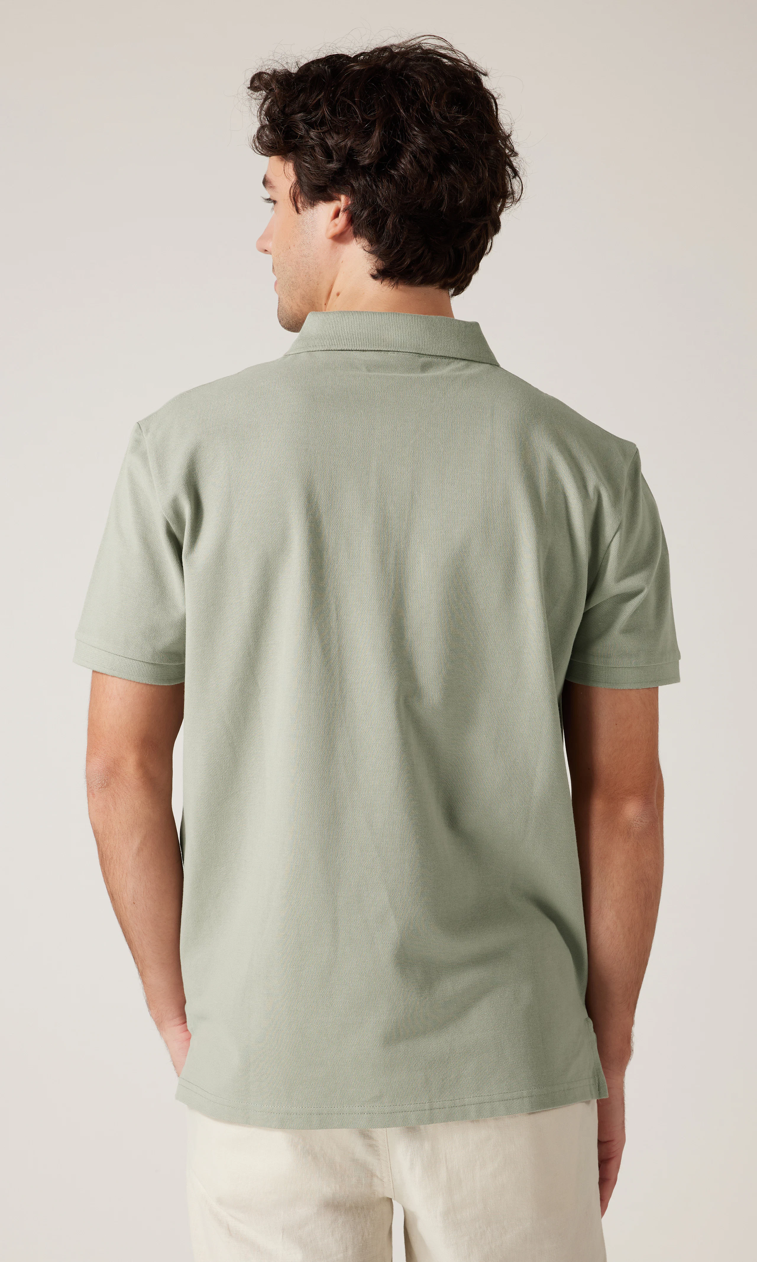 Polo Pikétröja. Back. Model.