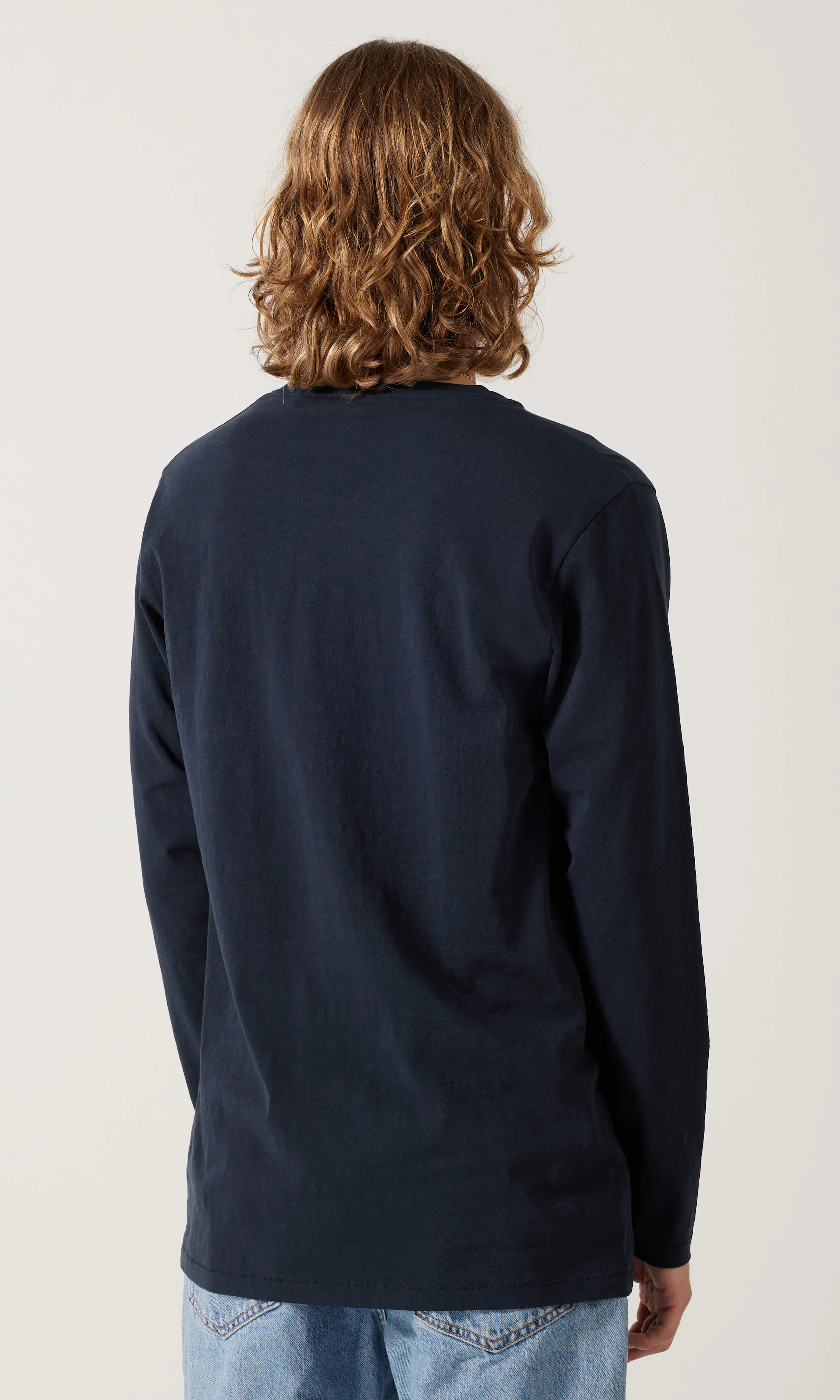 Buzz Long Sleeve. Back. Model.