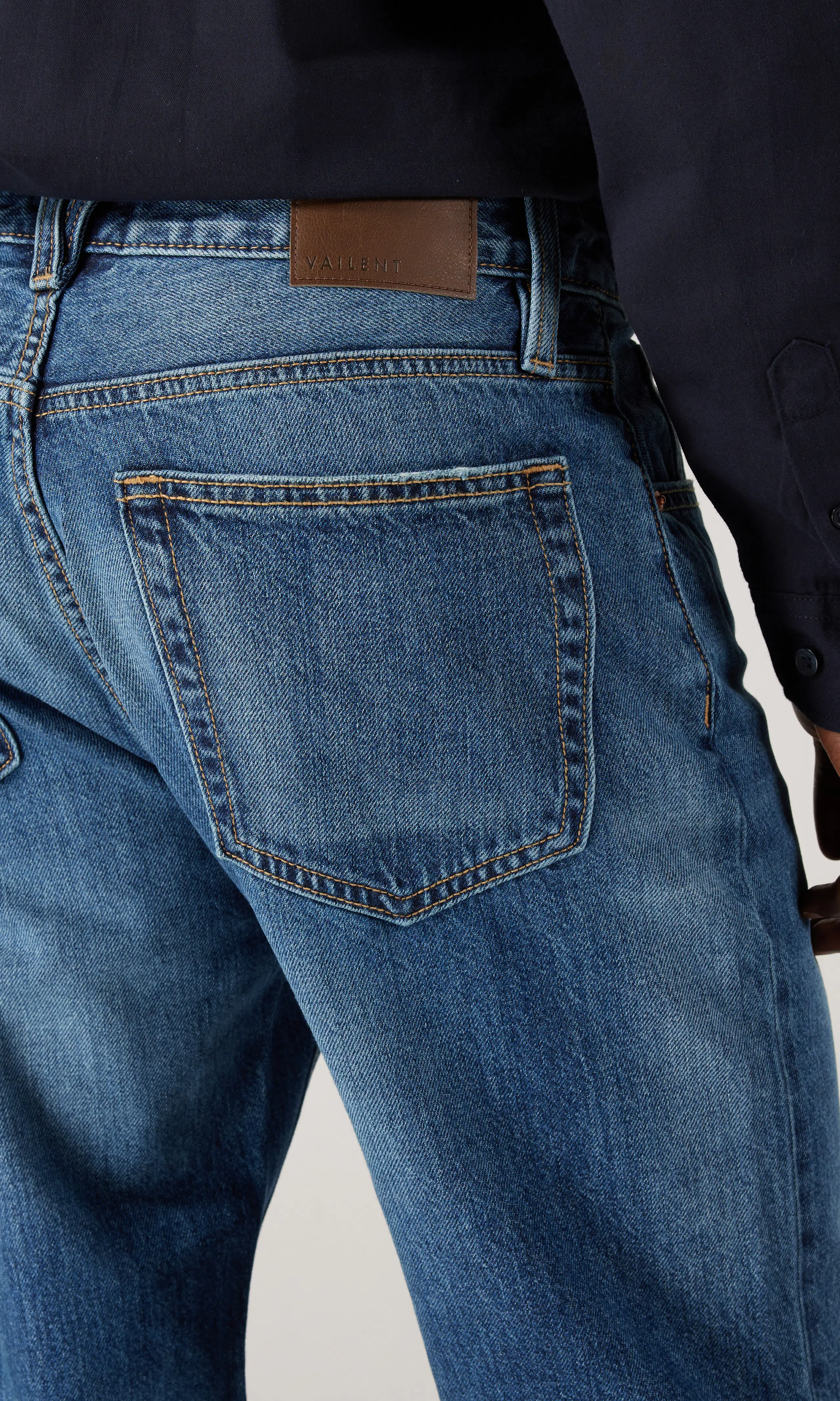 Tapered Jeans. Detail 2. Model.
