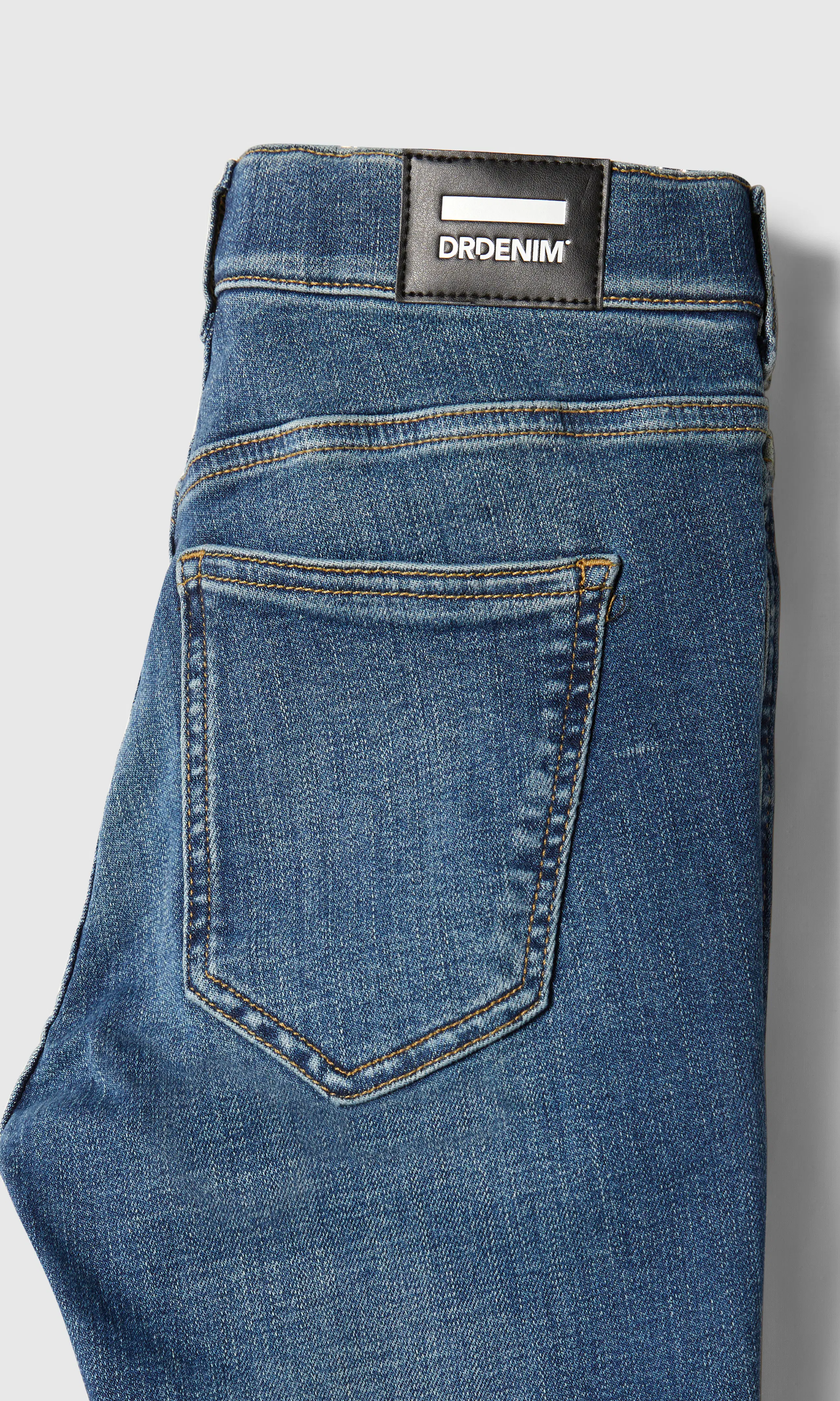 Lexy Mid Bootcut Medium Blå Jeans. Detail 1. Flat.