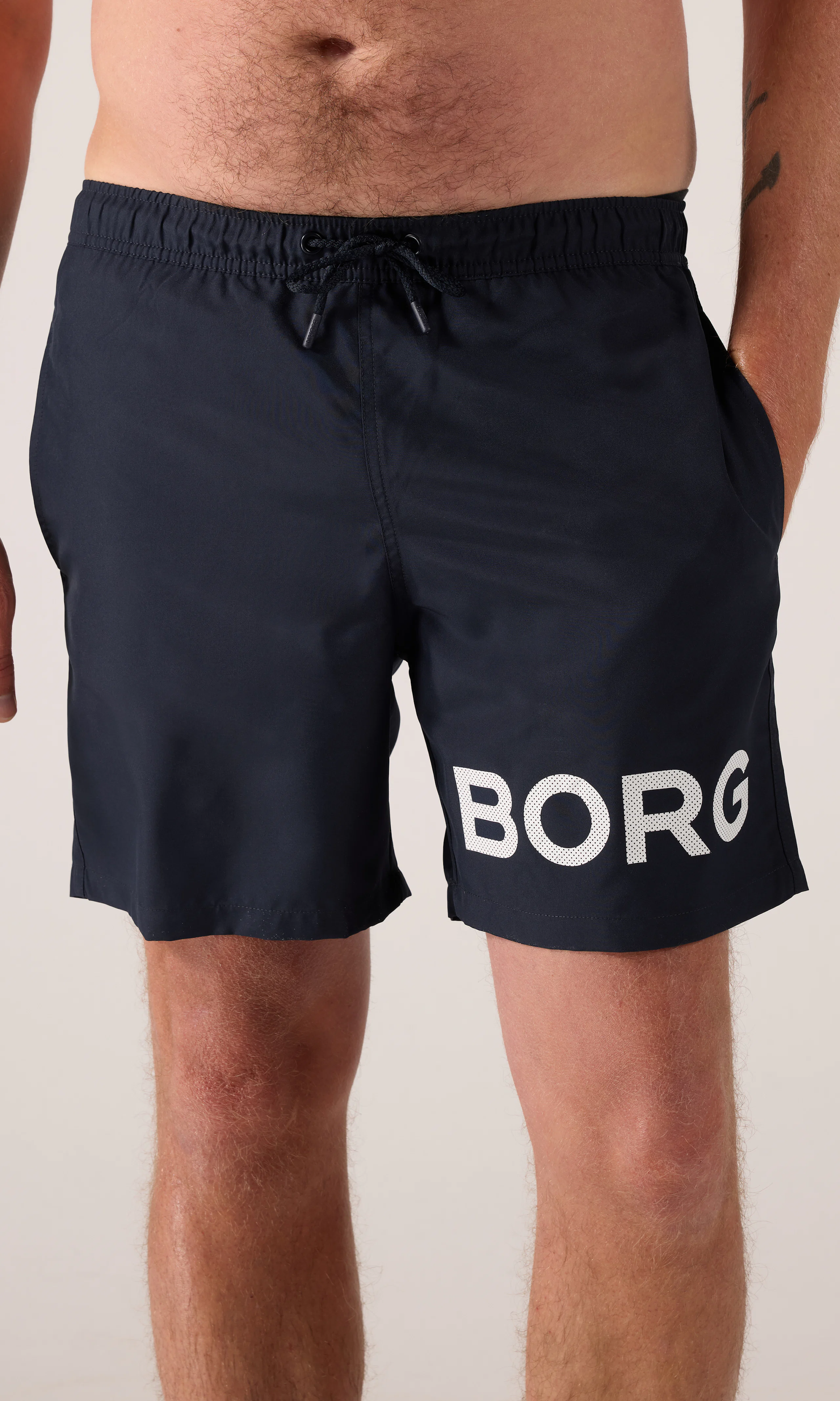Borg Tummansiniset Uimashortsit. Front. Model.