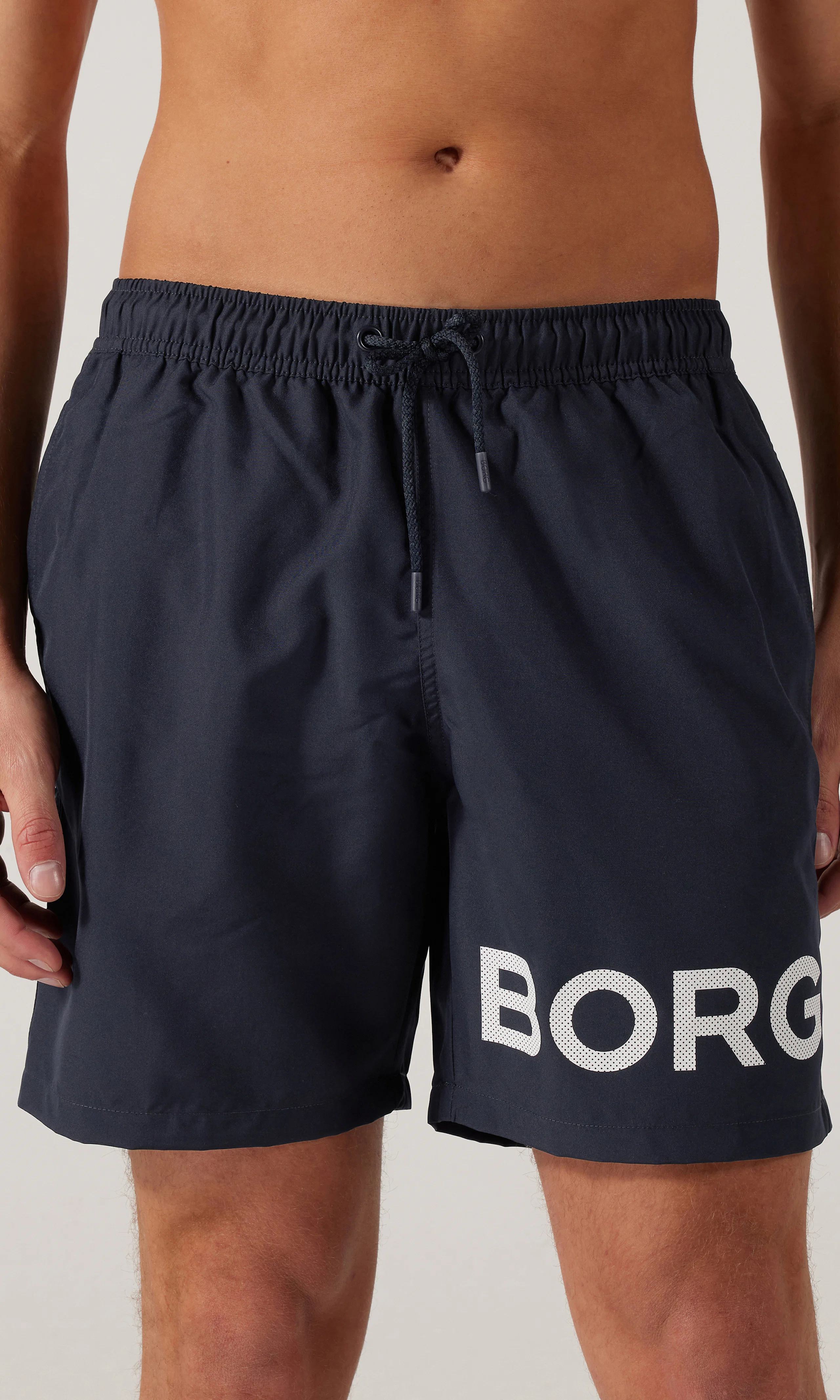 Borg Tummansiniset Uimashortsit. Front. Model.