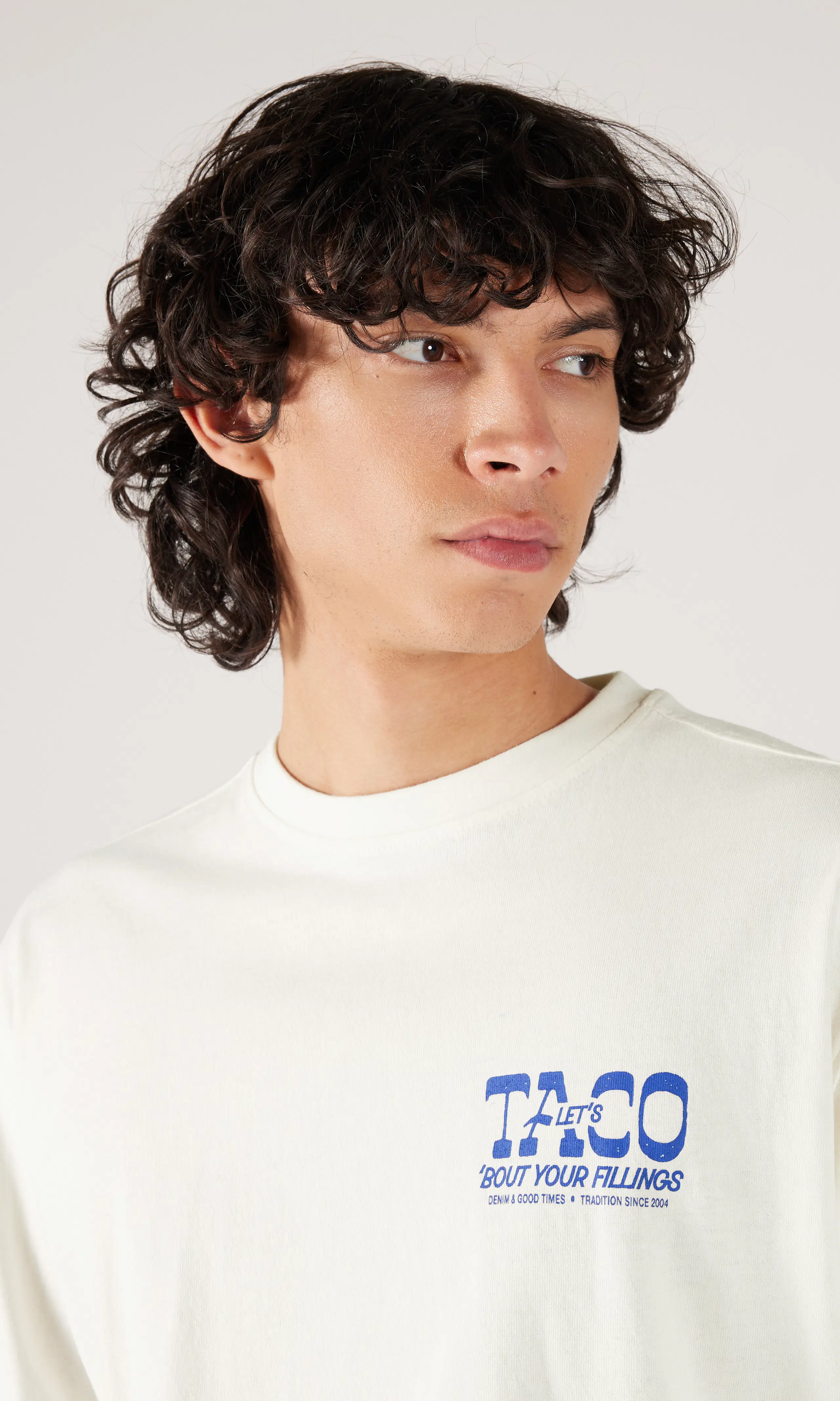 Caiden Off White Long Sleeve. Detail 1. Model.