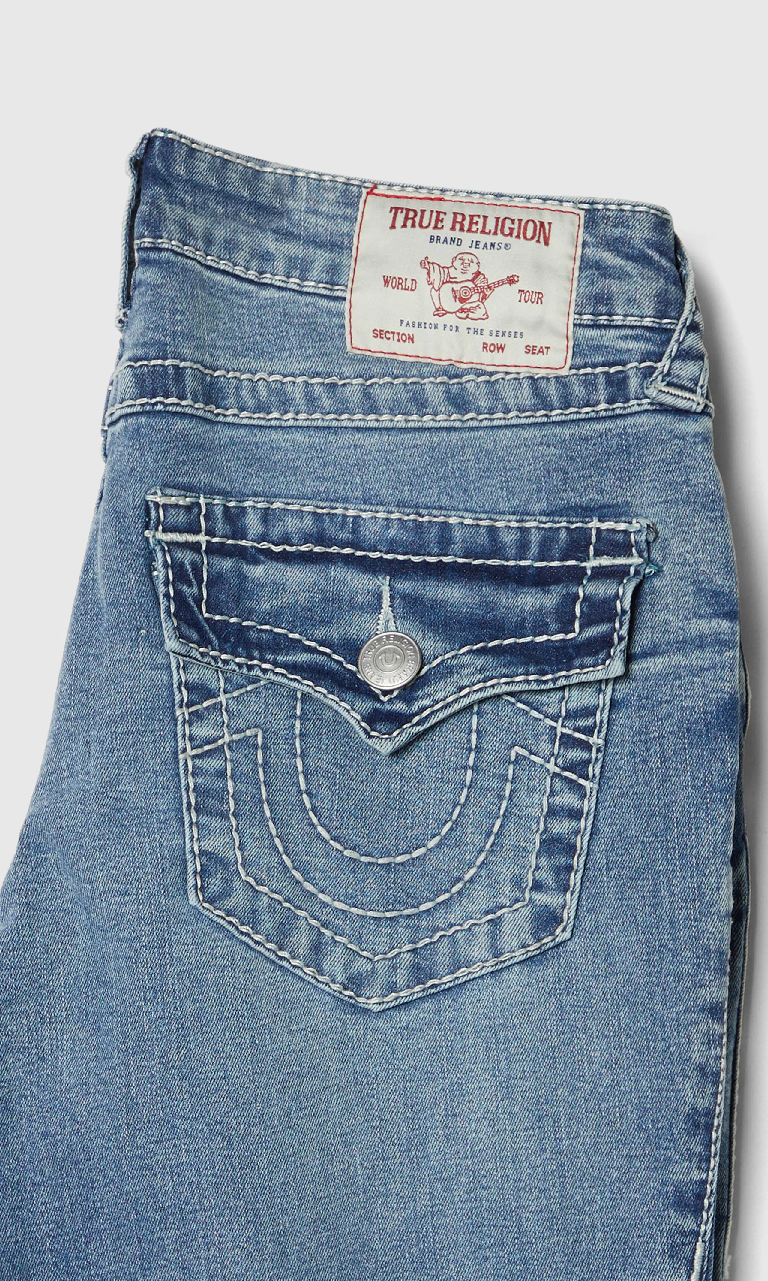 Becca Mid Rise Bootcut Flap Big T Ljusblå Jeans. Detail 1. Flat.