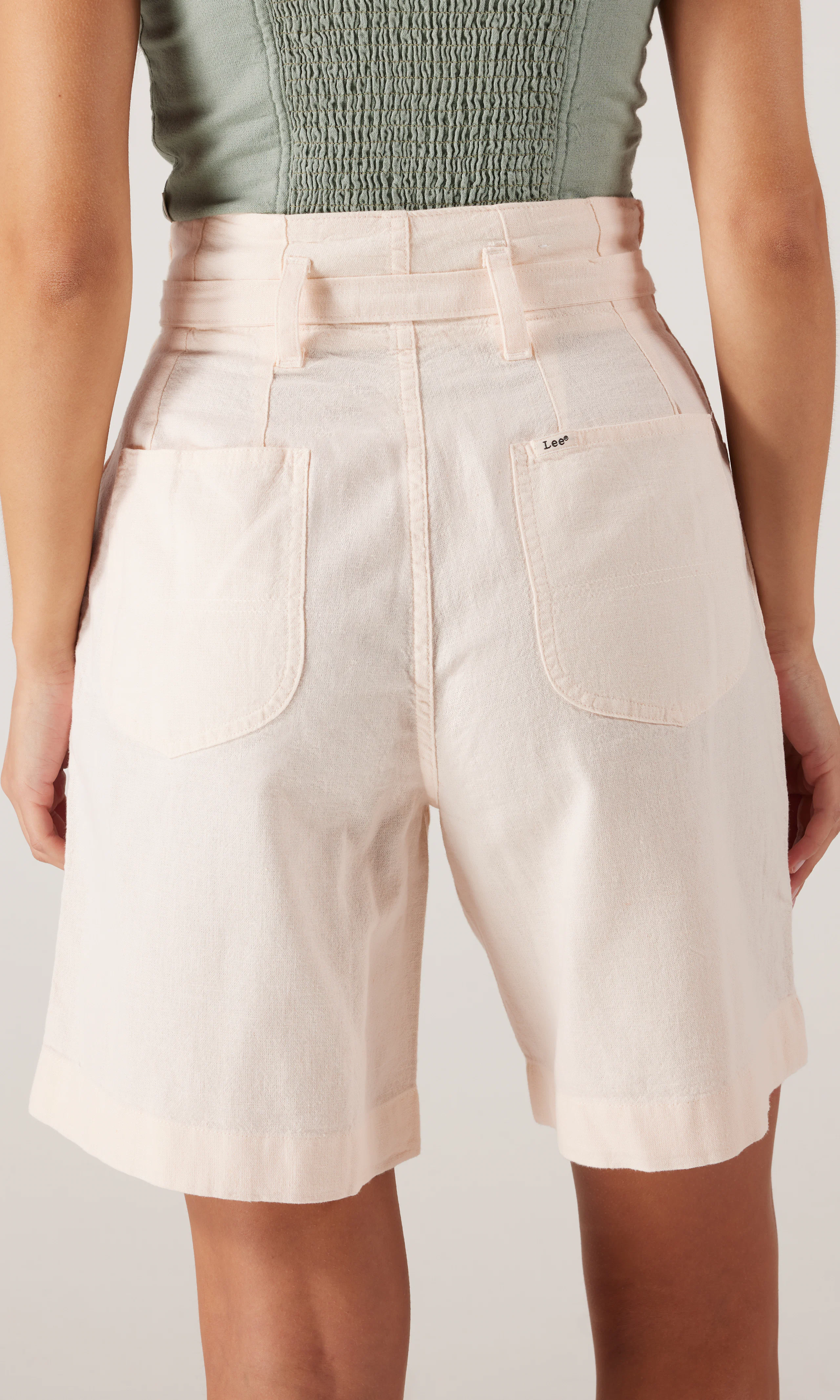 Pleated Bermuda Shorts. Back. Model.