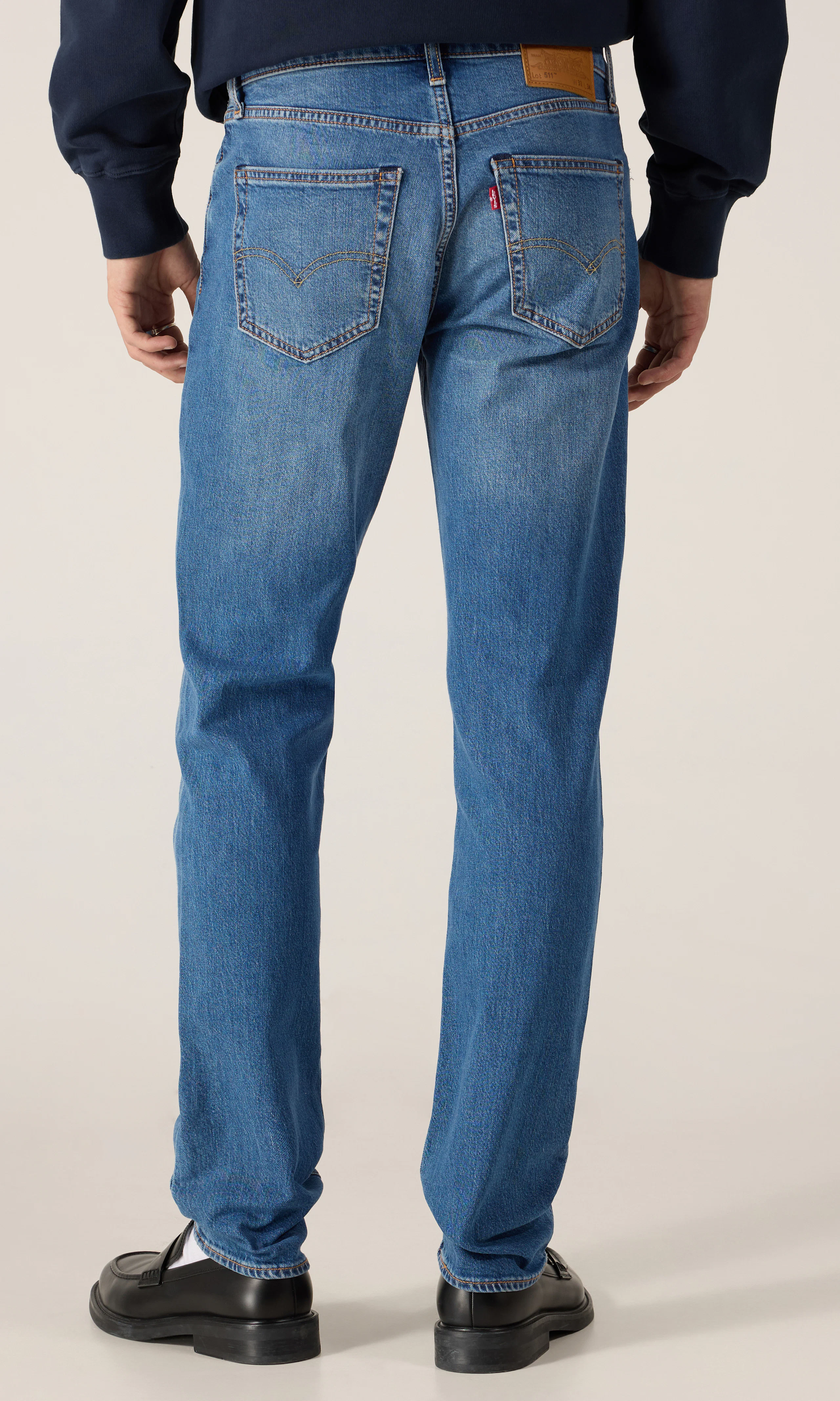 511™ Slim Jeans. Back. Model.
