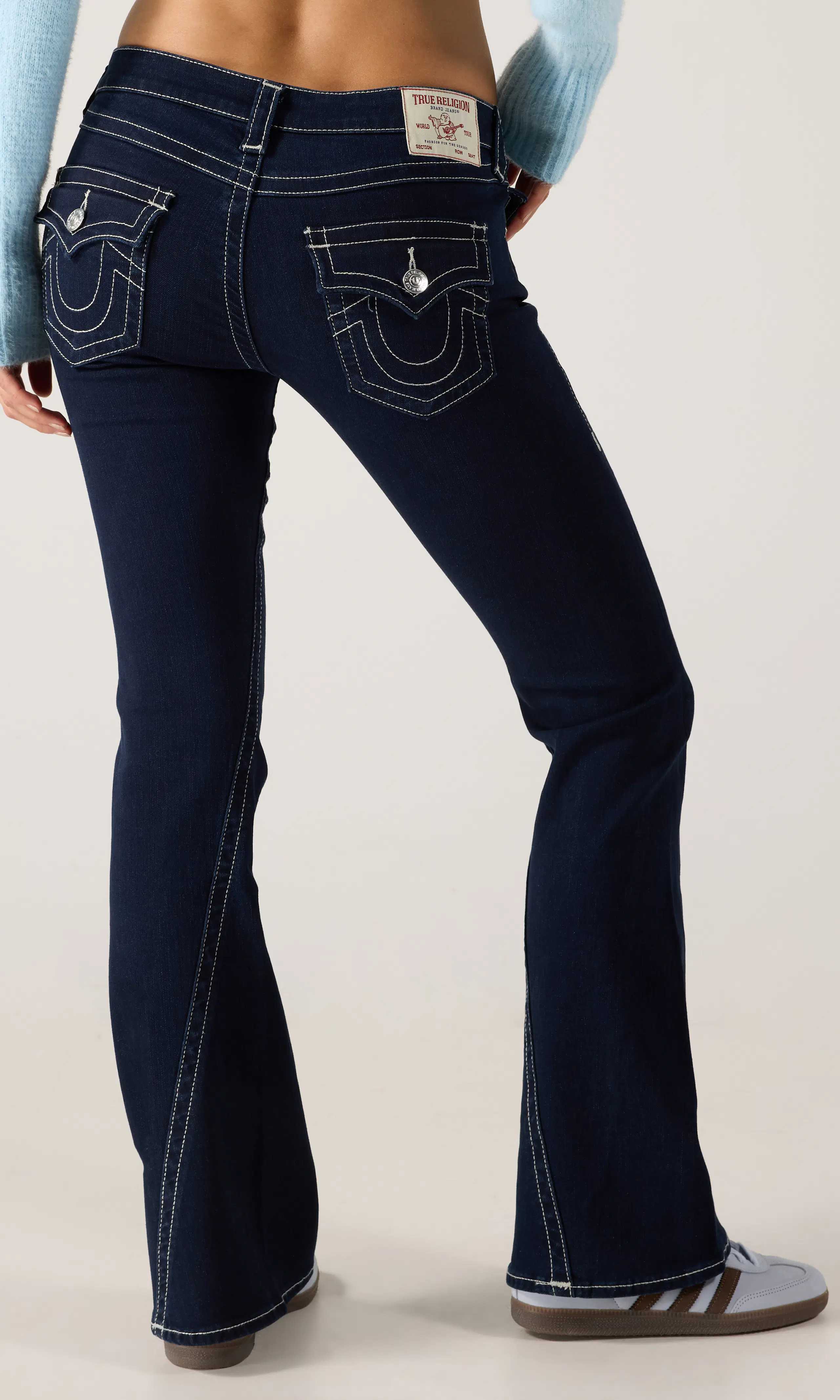 Joey Low Rise Flare Jeans. Back. Model.