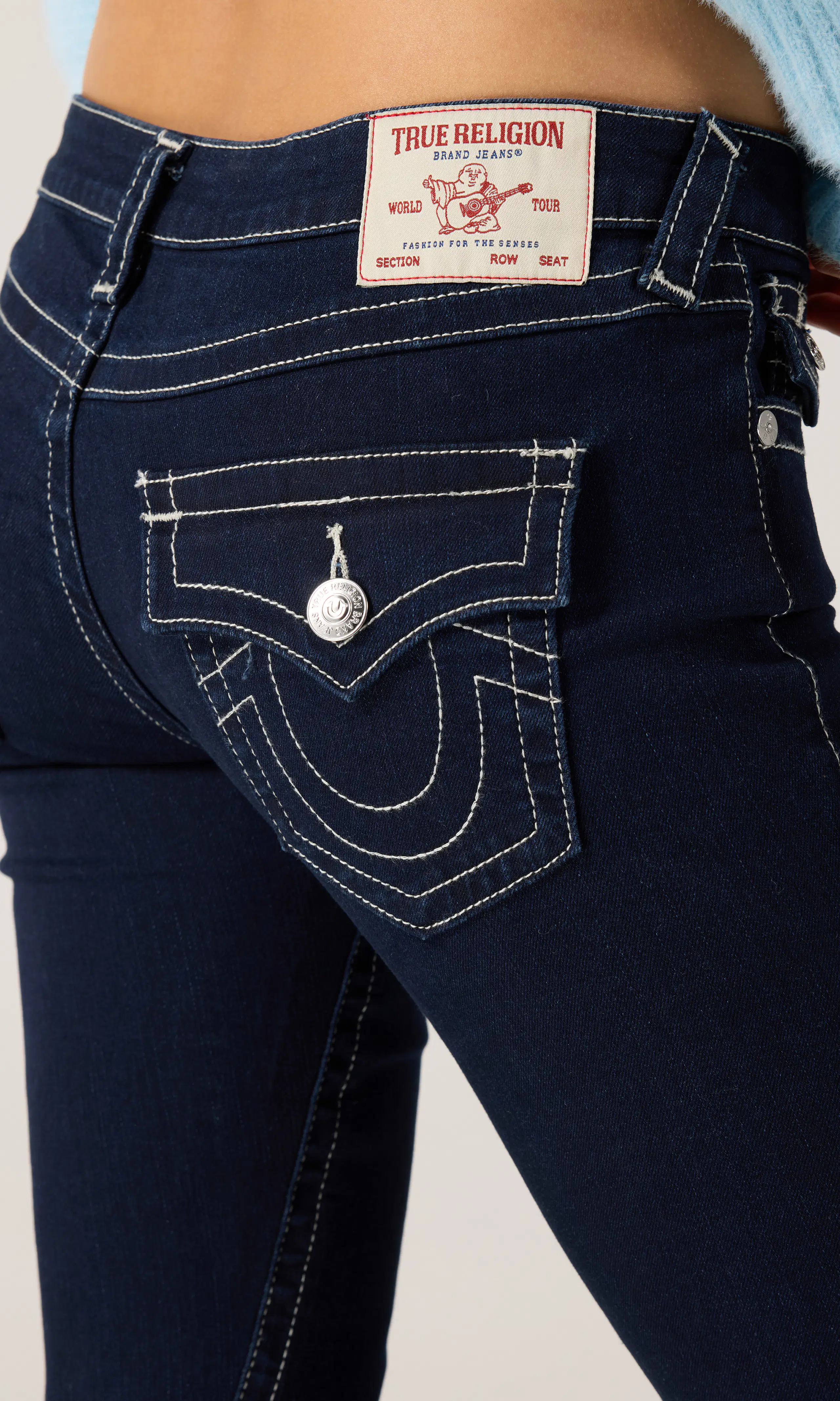 Joey Low Rise Flare Jeans. Detail 1. Model.