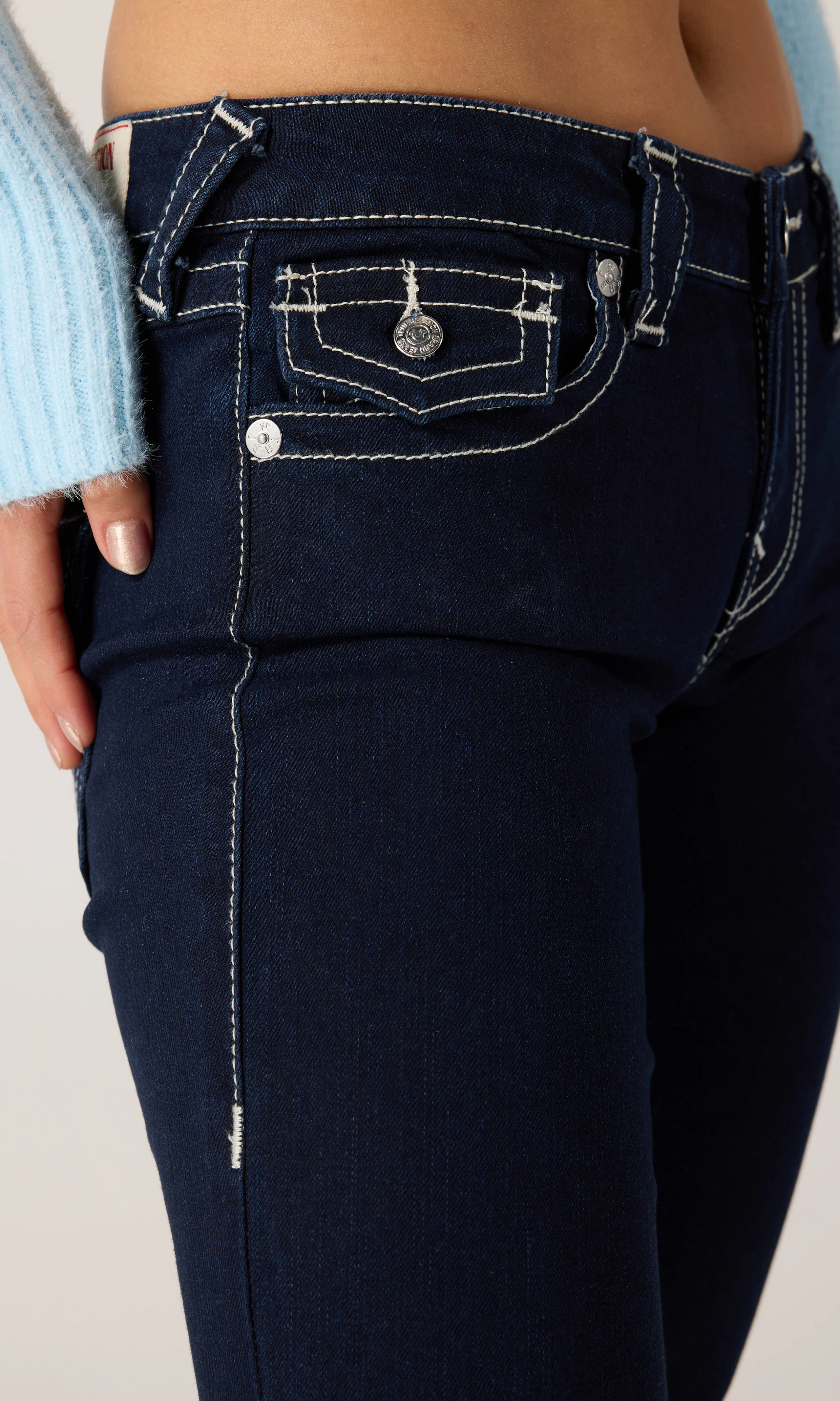 Joey Low Rise Flare Jeans. Detail 2. Model.