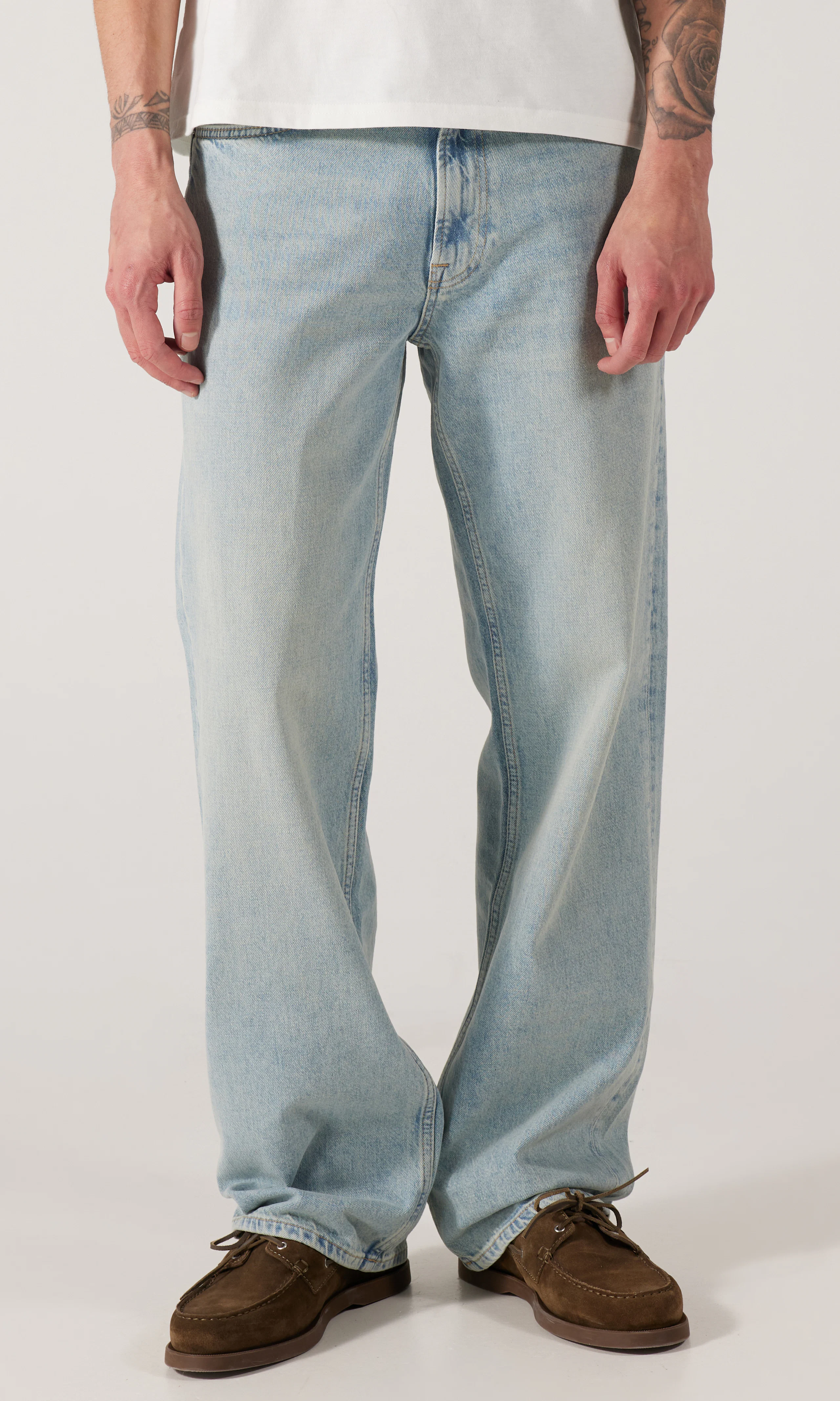 Wide Light Vintage Indigo Jeans. Front. Model.