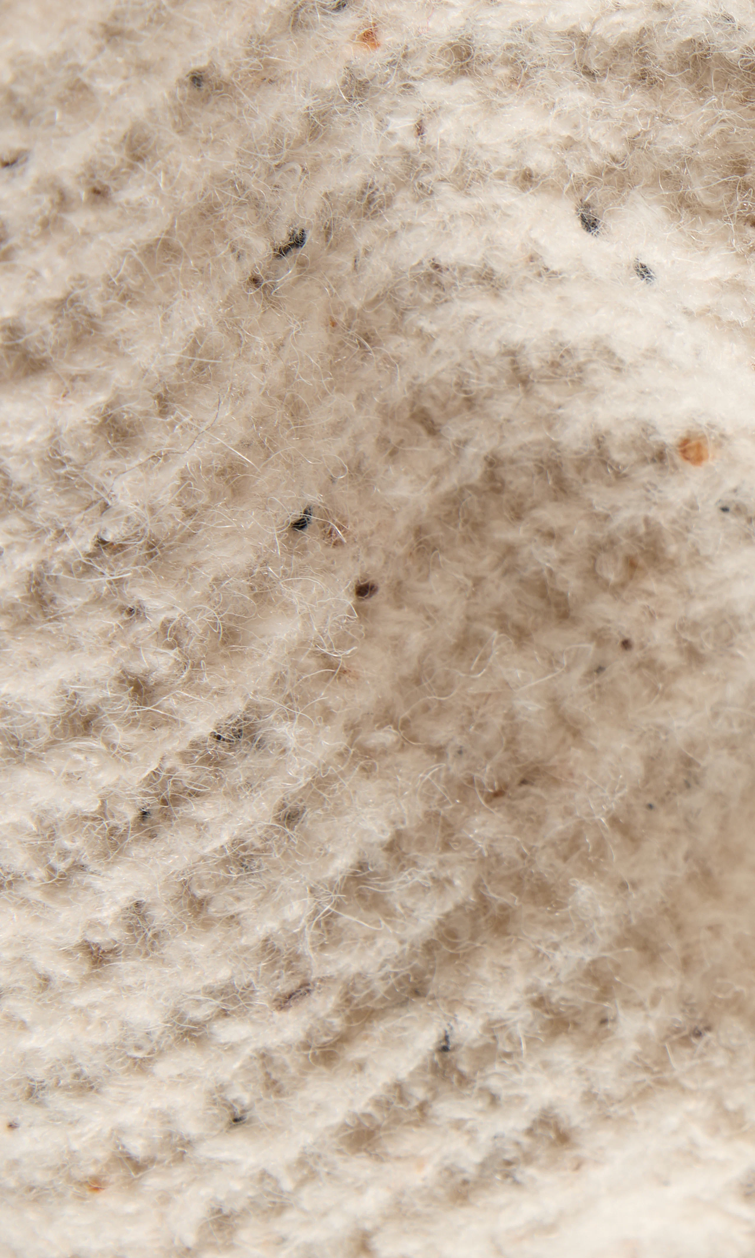Neps Stickad Cardigan. Detail 2. Flat.