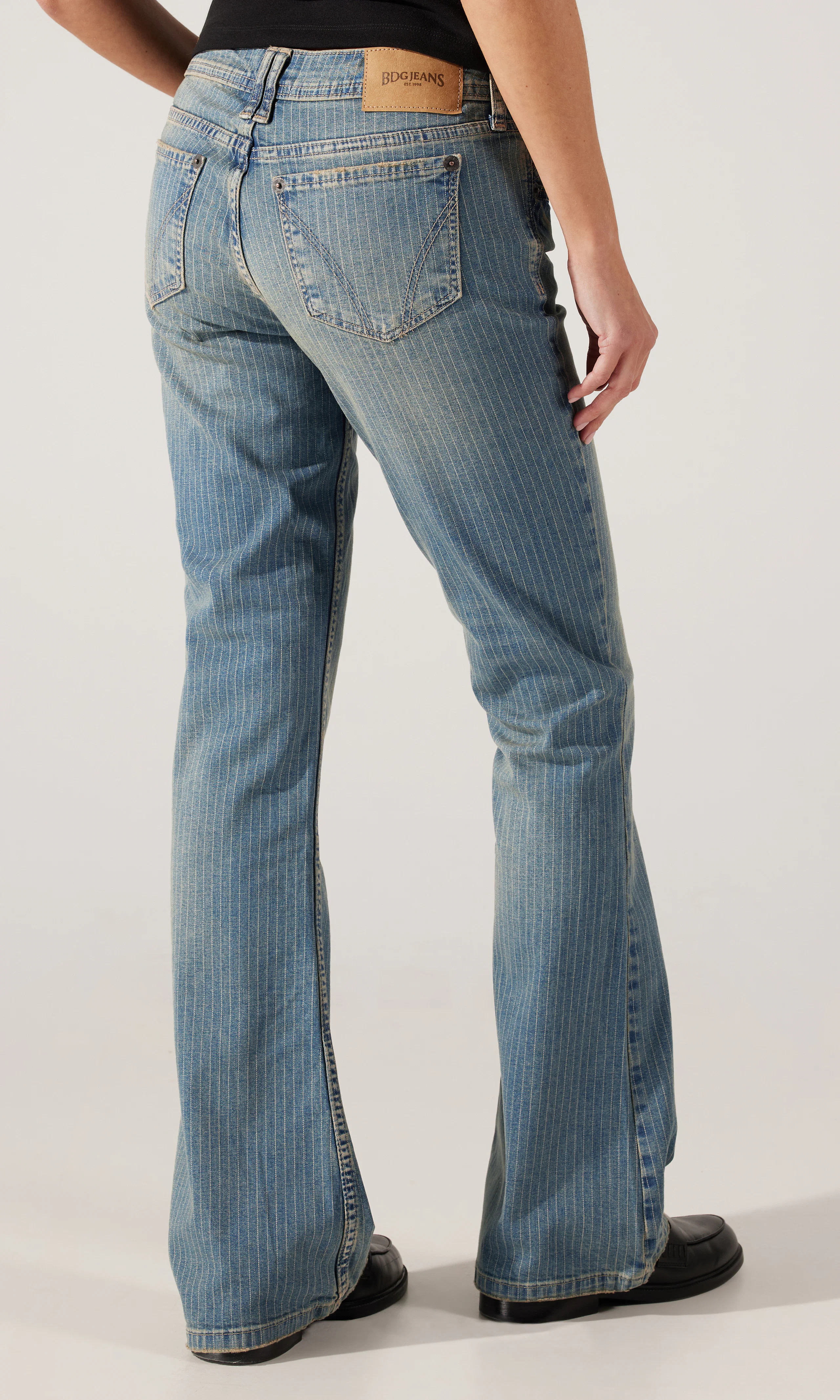 Brooke Pinstripe Flare Low Rise Jeans. Back. Model.