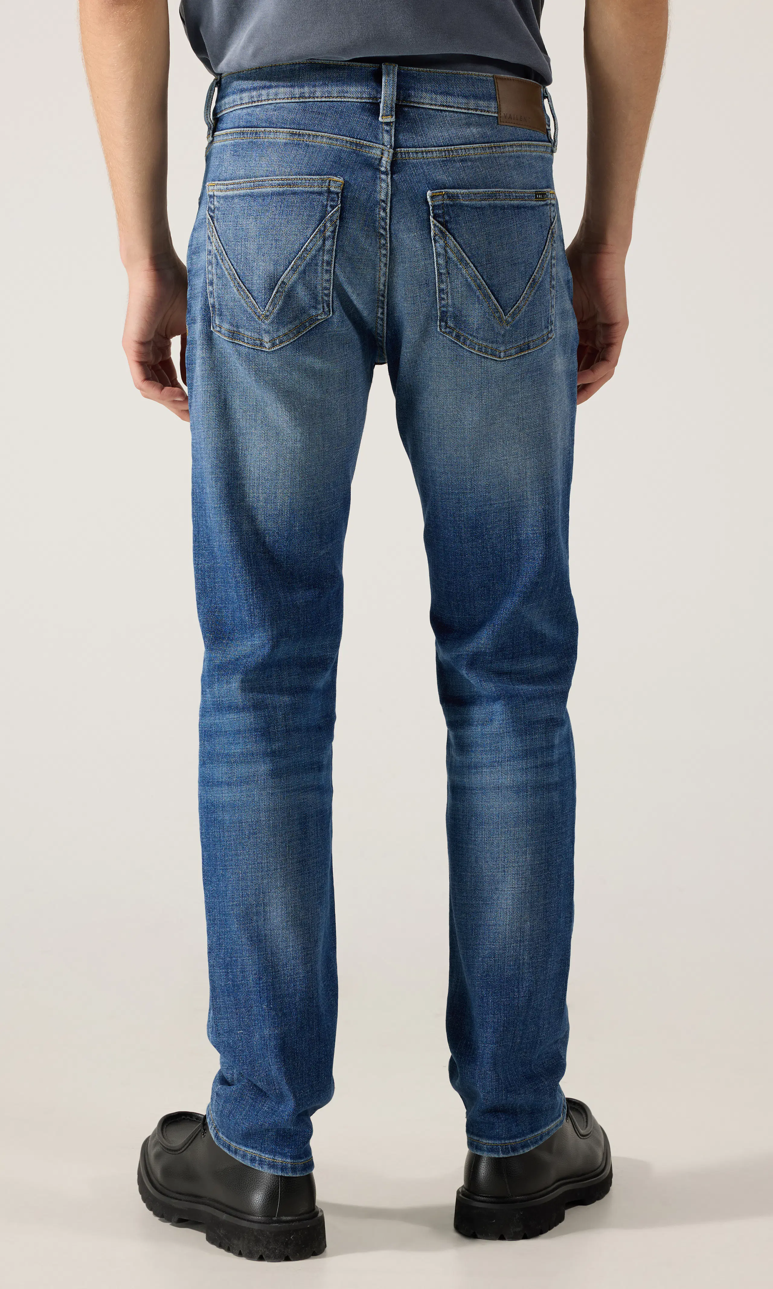 Regular Tapered Jeans. Back. Model.