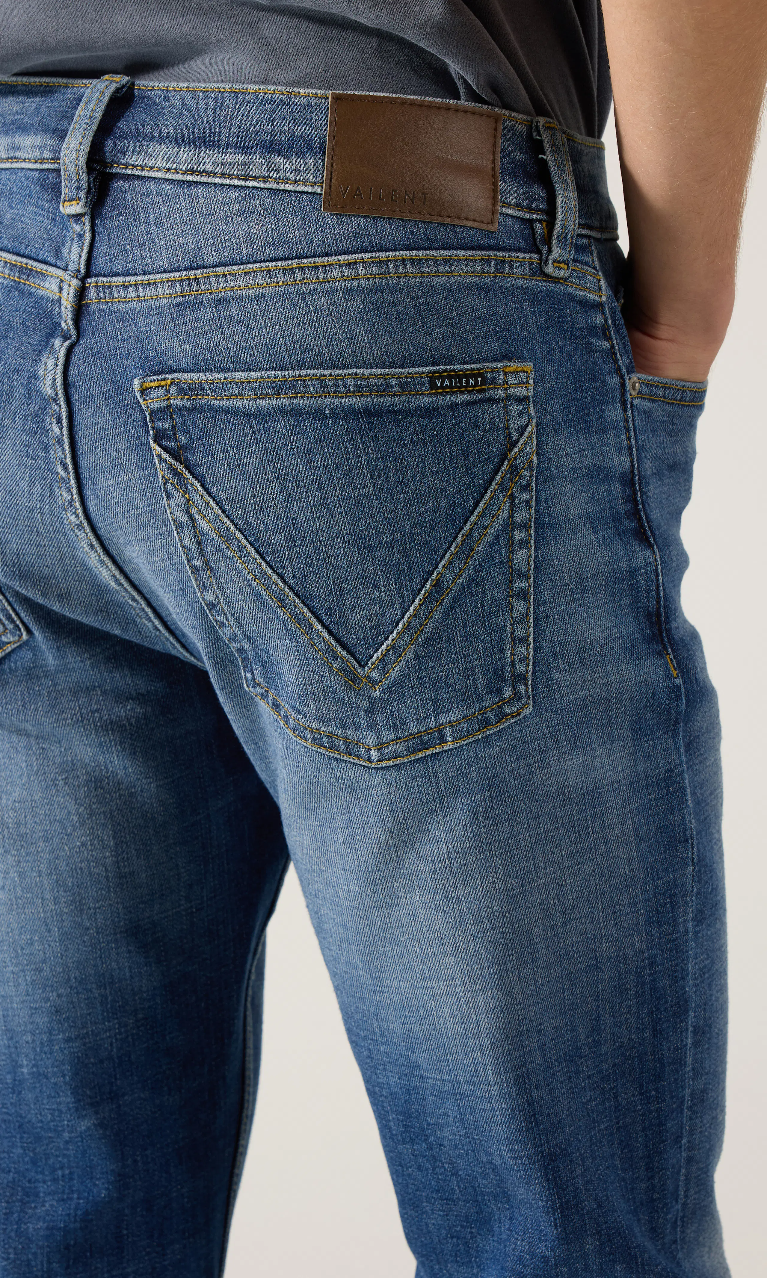 Regular Tapered Jeans. Detail 1. Model.