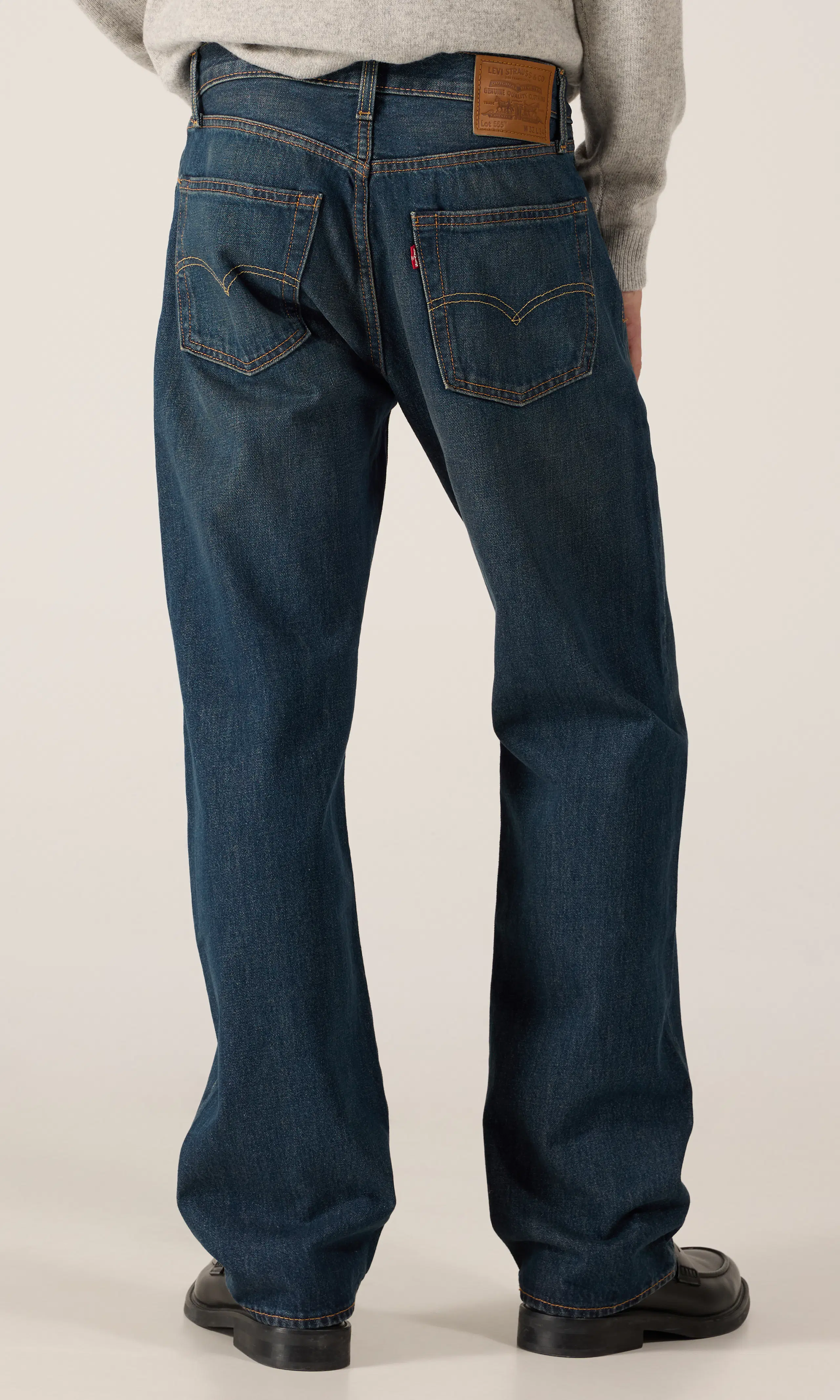 555™ Relaxed Straight Jeans. Back. Model.