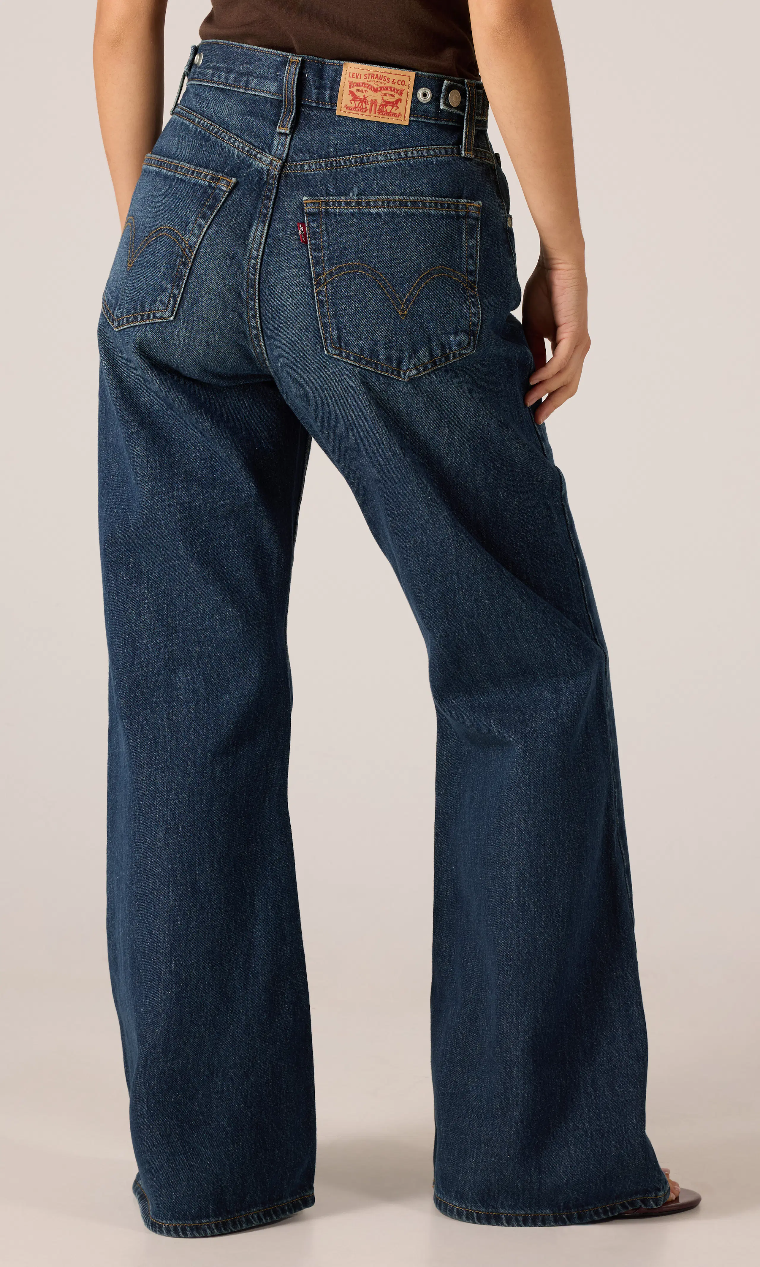Cinch Flare Jeans. Back. Model.