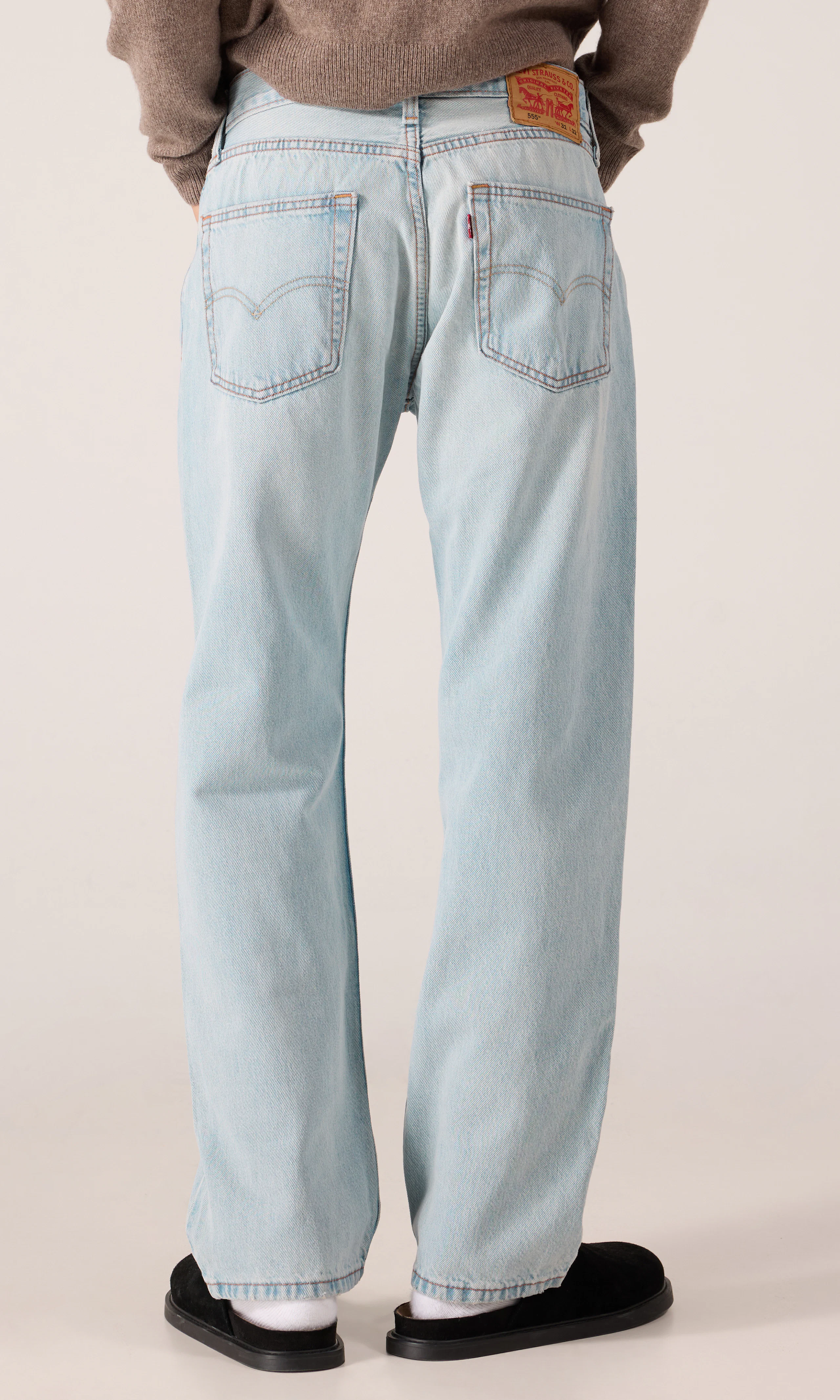 555™ Relaxed Straight Jeans. Back. Model.