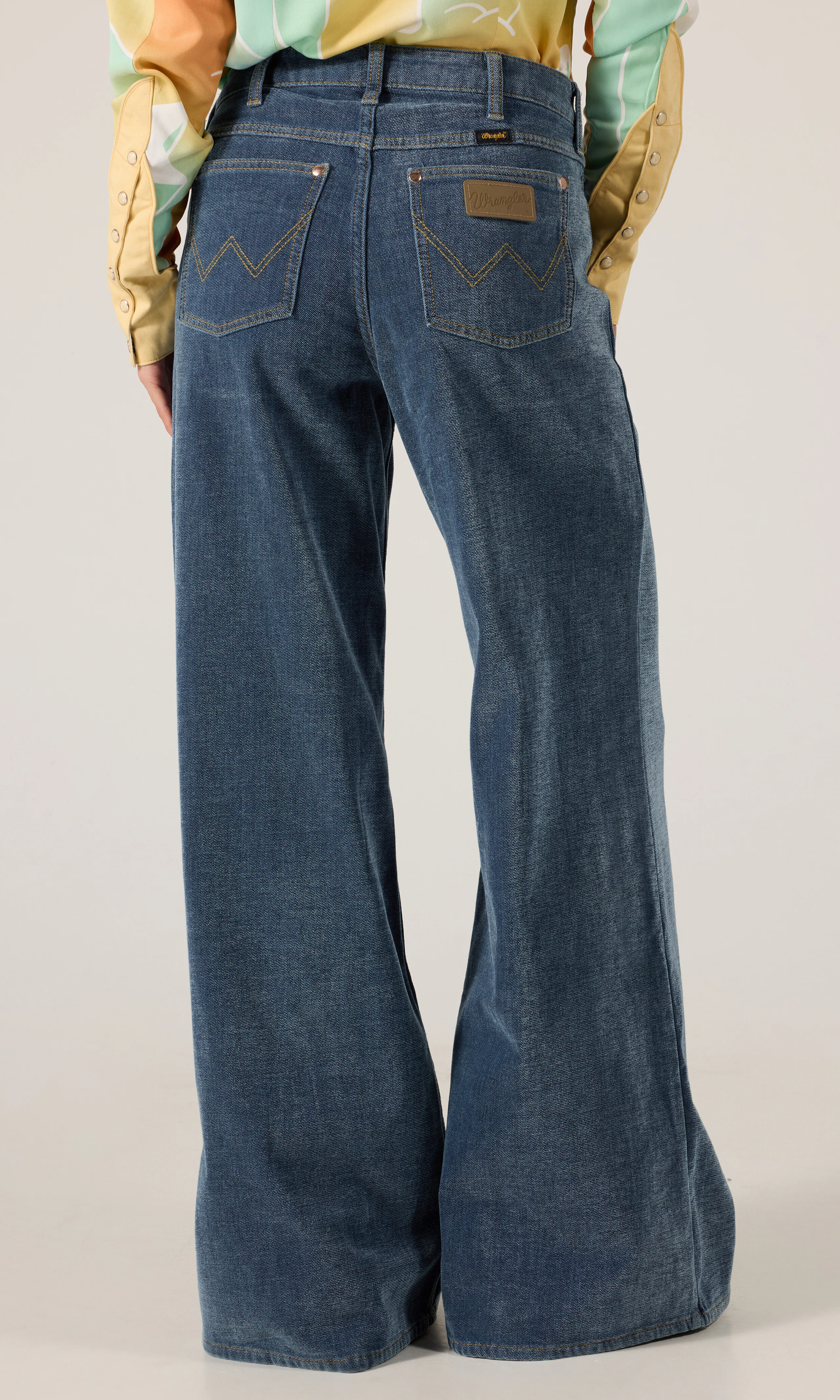 Lainey Wilson x Wrangler Cheeky Wide Leg Jeans. Back. Model.