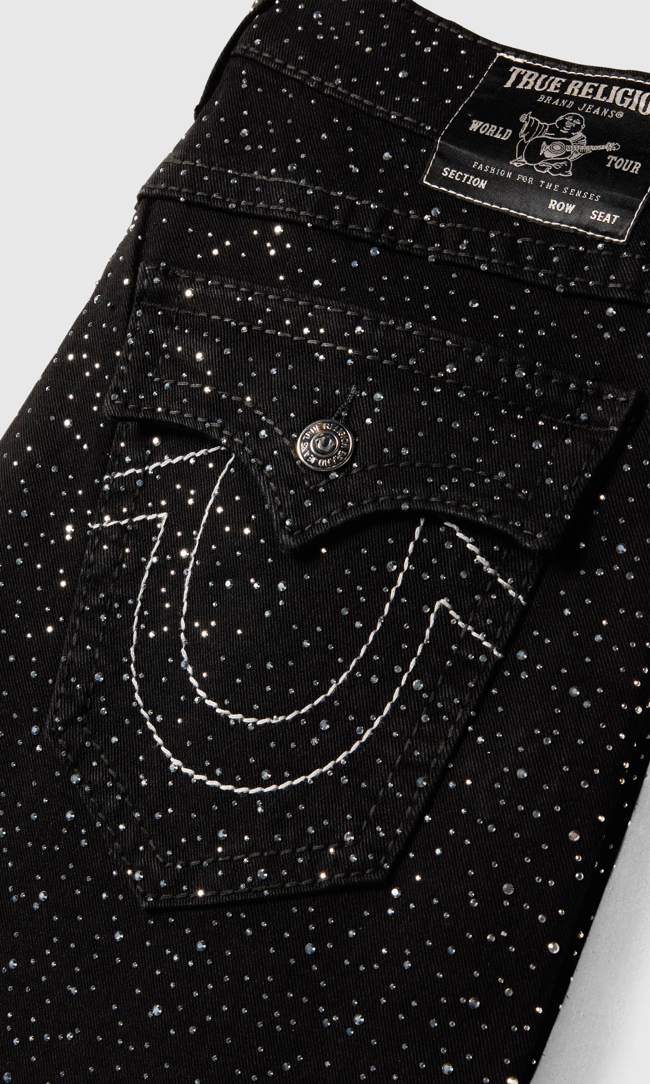 Bobby Crystal Big T Flap Svarta Jeans. Detail 2. Flat.